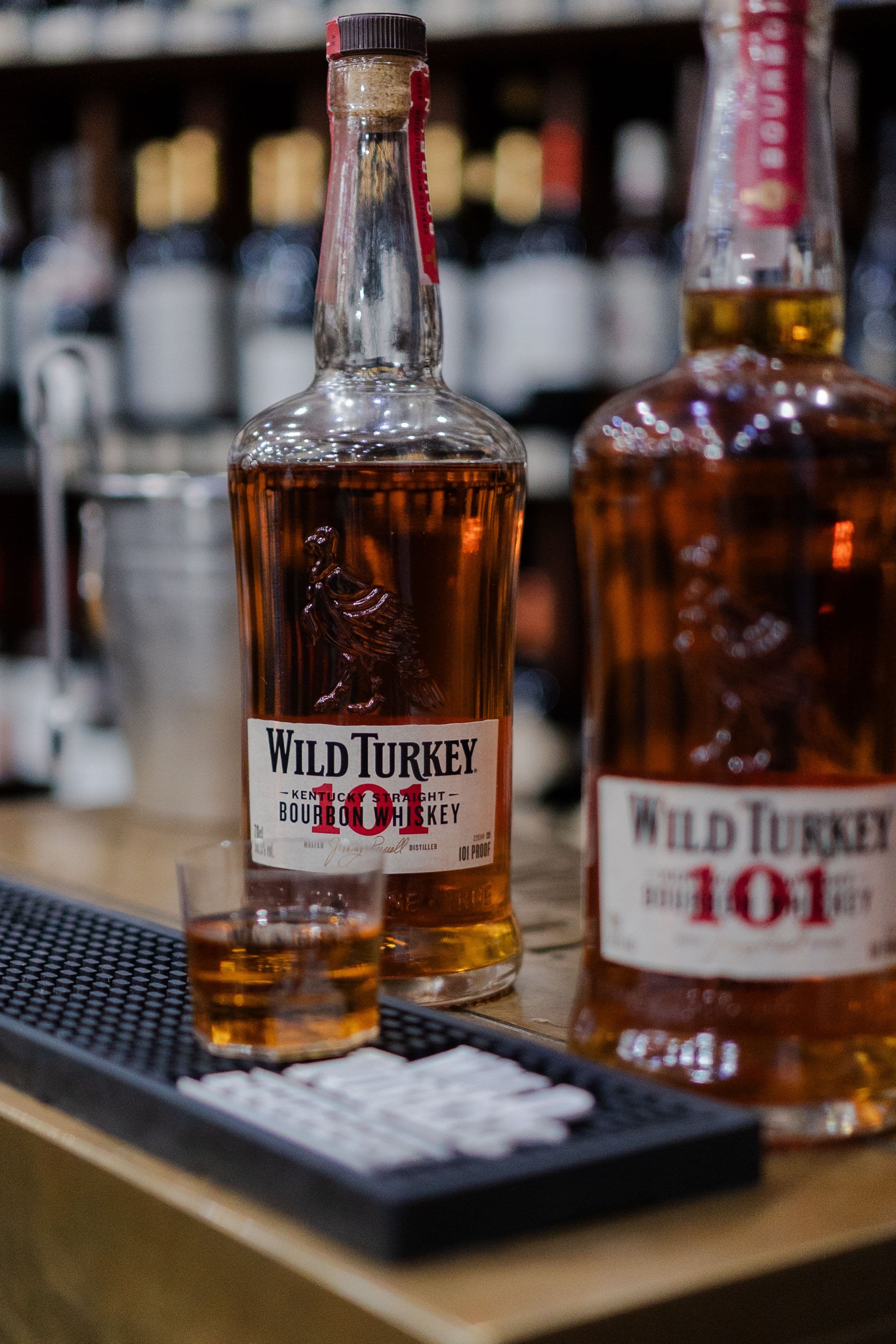 Bourbon bottles on a bar counter
